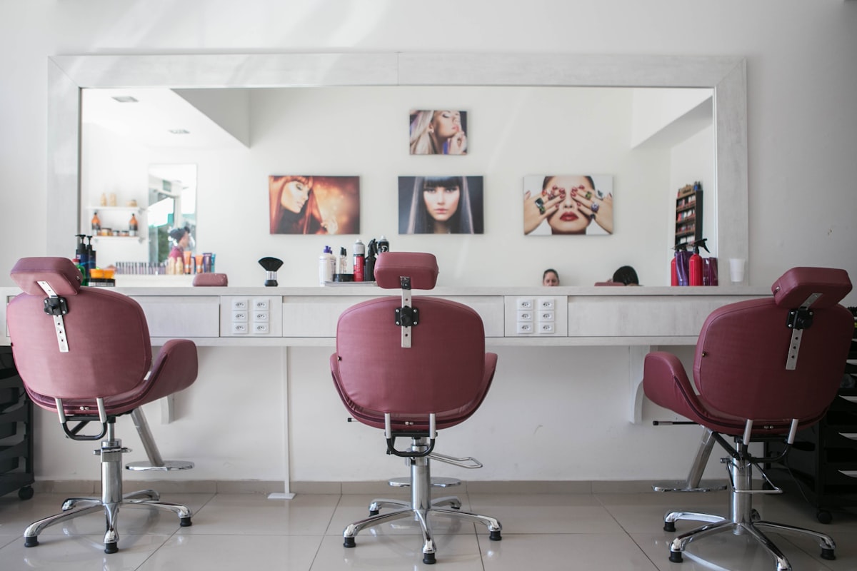 Bright beauty salon interior with styling chairs